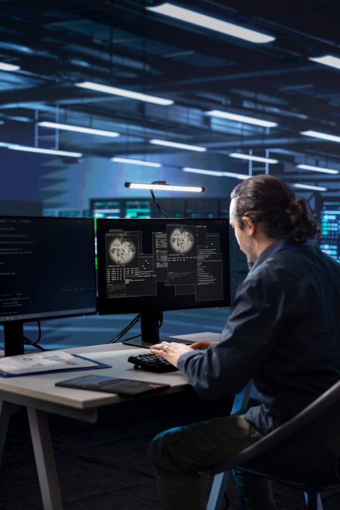 Technician working in data center overseeing international user traffic